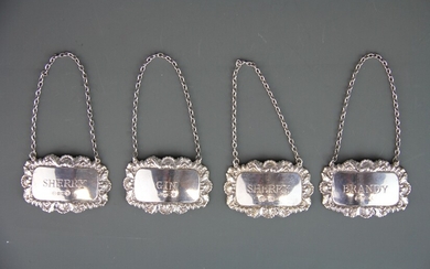 Four hallmarked silver decanter labels.