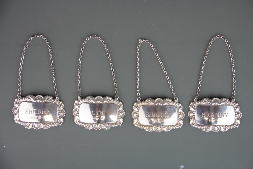Four hallmarked silver decanter labels.