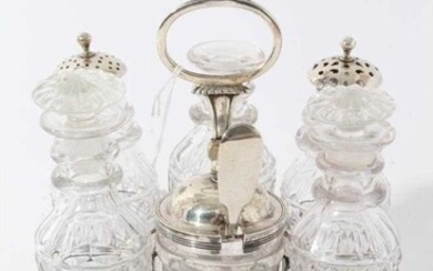 George III silver cruet frame of rectangular form with reeded decoration and central handle, on four fluted feet, with six matching cut glass condiment bottles, including three with silver mounts.