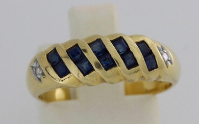 Gold ring set with 5 lines of calibrated sapphires with...