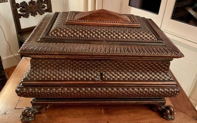 Large walnut chest with gilded fillets. Carved decoration...