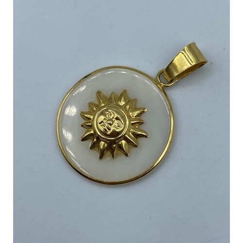 Mother of pearl pendant with sun design set in 18k yellow go...