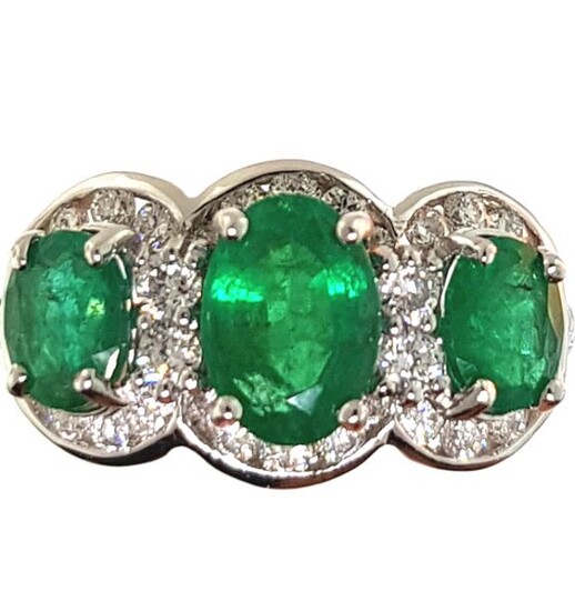 Ring in white gold 750°/°°° set with three emeralds in a circle of diamonds, Finger size 53, Gross weight: 3,92g