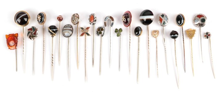 Twenty-Three Stick Pins; including a carbuncle garnet and seed pearl...