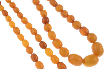 Two amber bead necklaces, two coral bead necklaces, a Bakelite scarf ring and a selection of Bakelite beads.