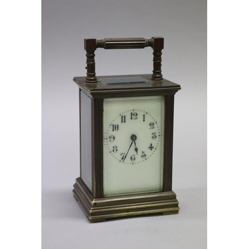 Victorian brass cased carriage clock with faux ivory enamell...