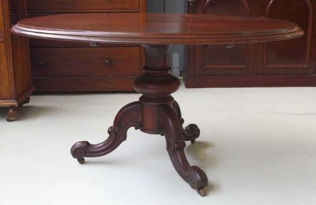 Victorian mahogany dining table with oval tilt top supported...