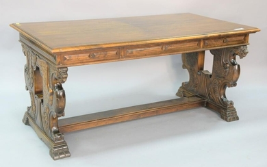 Walnut writing table having winged griffin supports