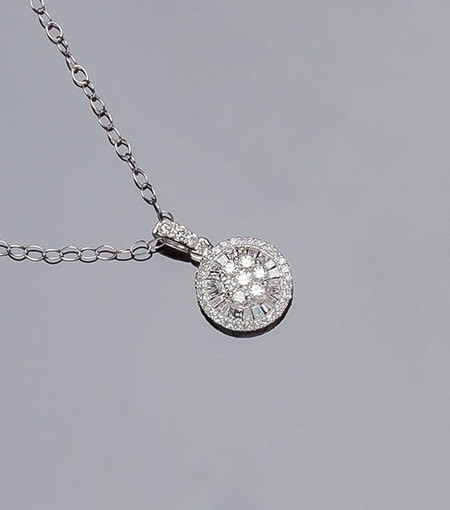 White gold chain and circular pendant, with a rosette...