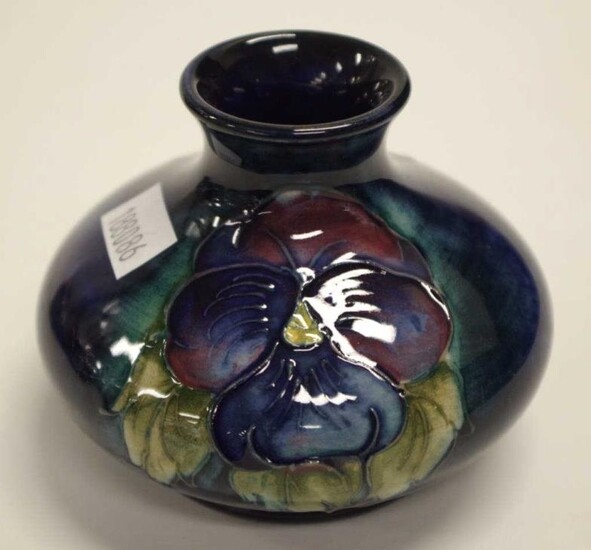 William Moorcroft 'Petunia' posy vase decorated on dark blue...