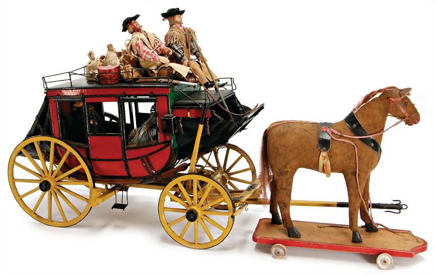 big filigree worked wooden coach, with a draft horse
