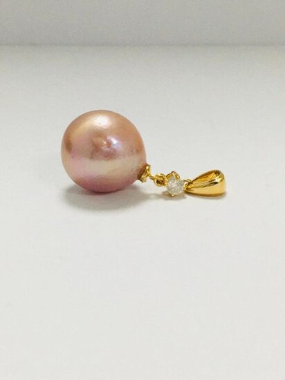 14ct Yellow Gold Pearl and Diamond pendant featuring,...