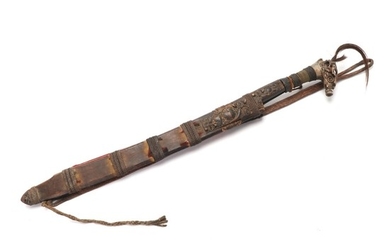 A good Mandau in its scabbard with knife.