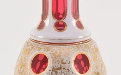 19th century red, white, cut to clear cut glass vase with gilt decoration. 13.25in high.