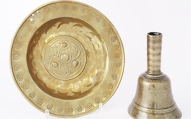 A pressed brass alms dish, probably late 17th century, 21cm diameter, and a brass table ...