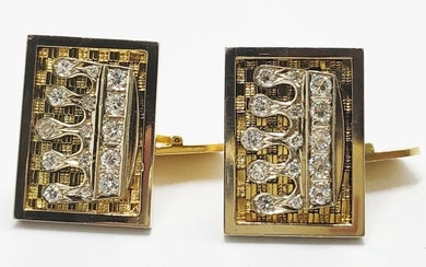 A pair of massive luxurious 18k diamond studded cuff-links