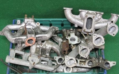 Crate of inlet manifolds for Hillman Imp, Ford Crossflow, BMC etc