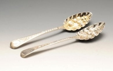 A pair of George III silver berry spoons, each with a