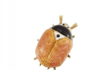A gold and enamel lady bird clip...