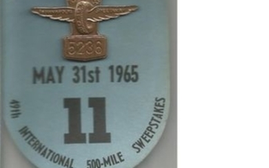 Indianapolis 1965 Bronze Pit Badge on original blue presentation card. Superb and rare complete, badge is numbered 5236....