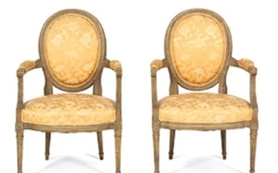 A Pair of Louis XVI Style Carved and Painted Fauteuils