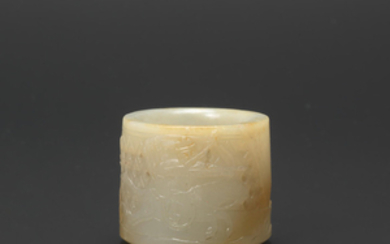 A white and russet reticulated jade thumb ring