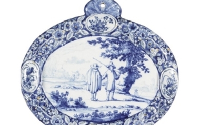 A Dutch Delft blue and white oval plaque, late 17th century