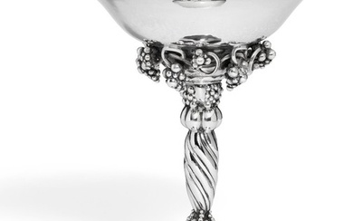 Georg Jensen: Sterling silver tazza with grapes and hammered surface. Spiral fluted stem and circular foot. H. 18.7 cm.