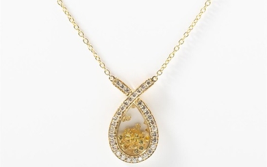 A 14 carat gold, diamond and sapphire pendant...