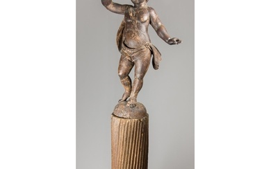 A 17TH/18TH CENTURY CARVED WOOD PUTTI UPON A FLUTED COLUMN. ...
