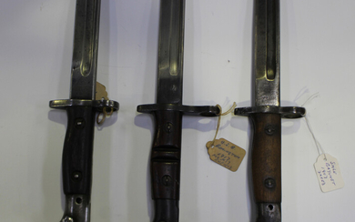 A 1917 model bayonet by Remington, blade length 43cm, with scabbard, together with a 1907 pattern ba