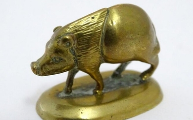 A 19thC brass model of a pig / boar. Approx. 1" high
