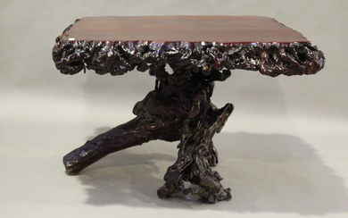 A 20th century root table, the square top raised on a gnarled root base, height 76cm, width 116cm, d