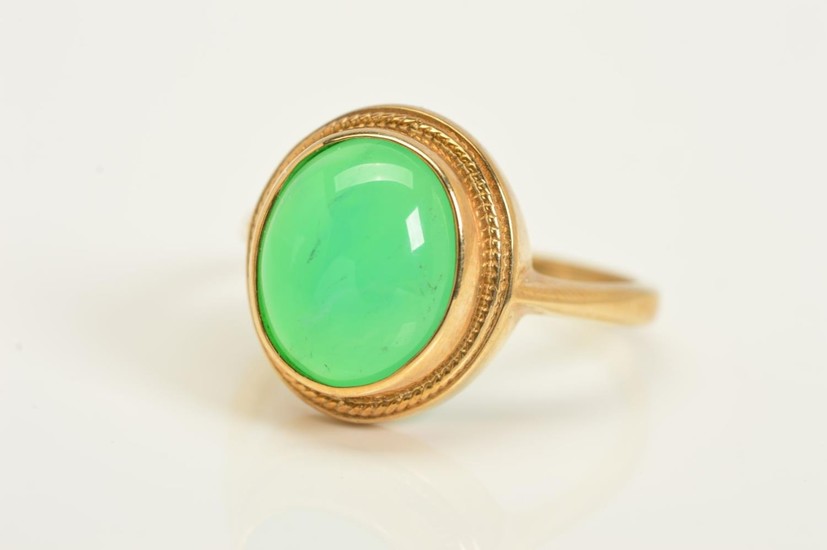 A 9CT GOLD GEM RING, designed as an oval chrysoberyl cabocho...