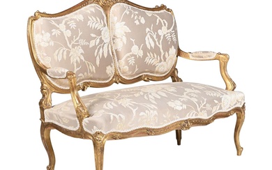 A CARVED GILTWOOD AND UPHOLSTERED CANAPE IN LOUIS XV STYLE