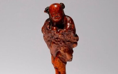 A CHINESE BURR WOOD FIGURE OF A BOY LATE QING...