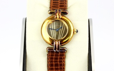 A Cartier Paris Vermeil Quartz gold on 925 silver wristwatch (no. 058249, 590002) on a brown leather strap.