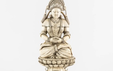 A Chinese Buddha holding a Pagoda, sculptured ivory. Circa 1900. (L:10 x W:12 x H:31 cm)