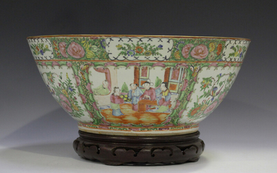 A Chinese Canton famille rose porcelain punch bowl, late 19th century, typically painted with panels