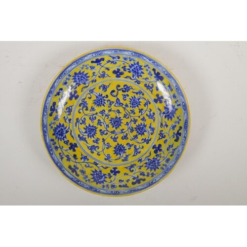 A Chinese Ming style yellow ground porcelain dish decorated ...