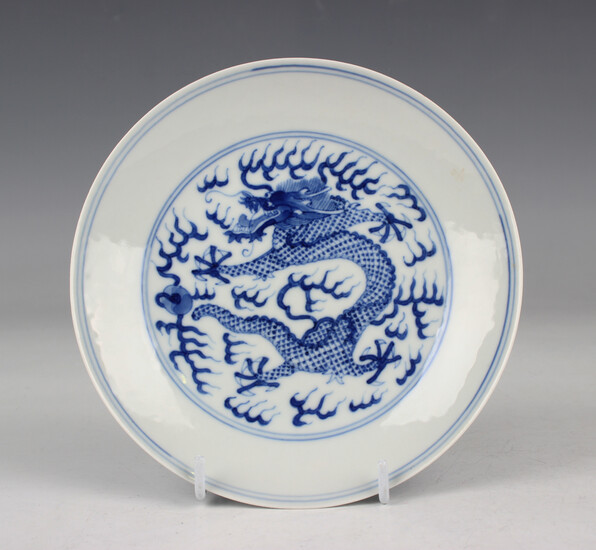 A Chinese blue and white porcelain circular saucer dish, mark of Guangxu but later, the centre and u
