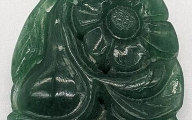 A Chinese green jade carving of flowers and fruit