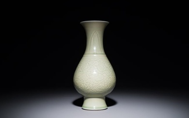 A Chinese monochrome celadon-glazed vase with anhua floral design, Kangxi