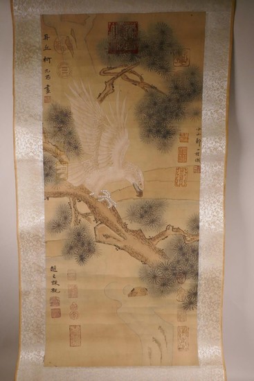 A Chinese watercolour scroll depicting an eagle on a cypress...