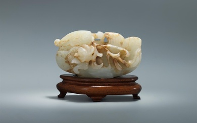 A Chinese white and russet jade model of a mandarin duck