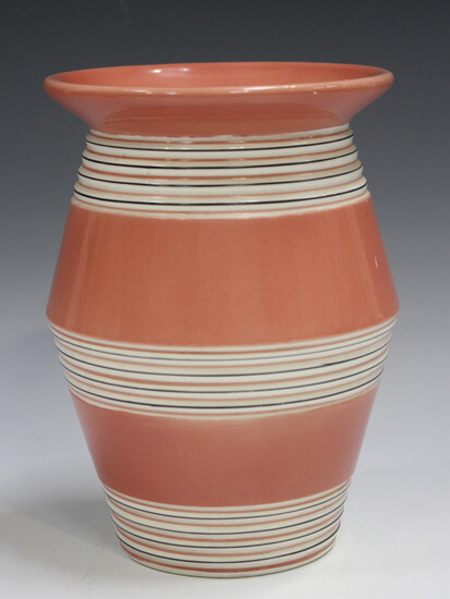A Clarice Cliff Bizarre vase, 1930s, the salmon pink body with black and white banded decoration, pr
