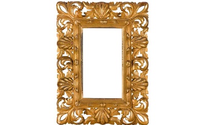 A FLORENTINE 19TH CENTURY CARVED, PIERCED, SWEPT AND GILDED FRAME
