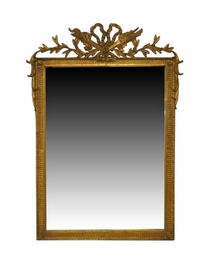 A French giltwood mirror, 18th century style, the bevelled plate beneath ribbon cresting, with label and stamped Carvers Guild, 90cm x 72cm Provenance: The Geoffrey and Fay Elliot collection.