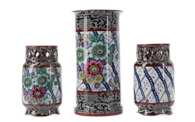 A GARNITURE OF THREE LATE VICTORIAN EARTHENWARE SPILL VASES