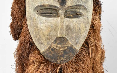 A Galoa People, Gabon, mask with raffia detail and black...
